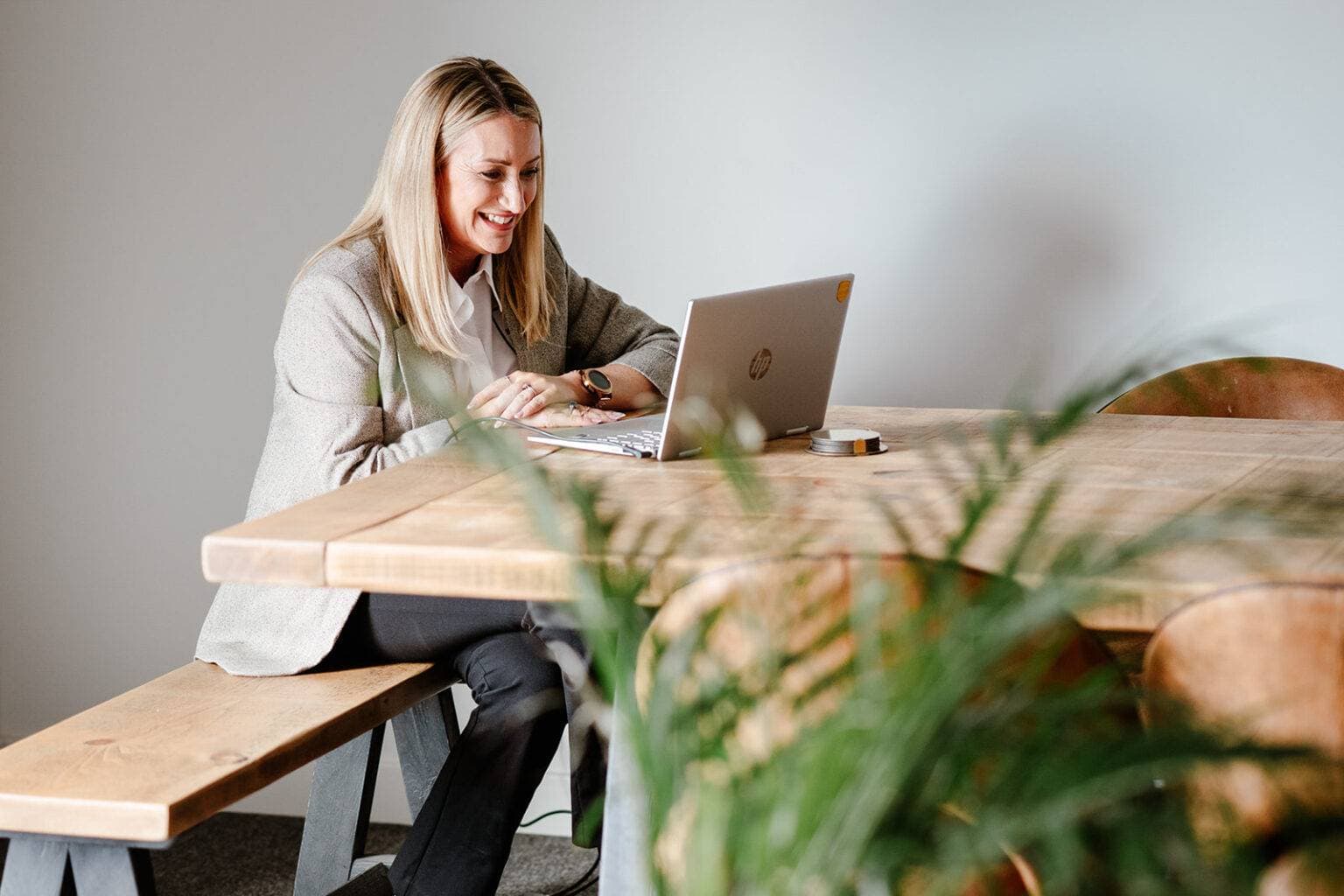 A Mindset HR consultant working at a laptop in the office